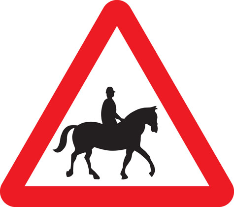 warning sign accompanied horses