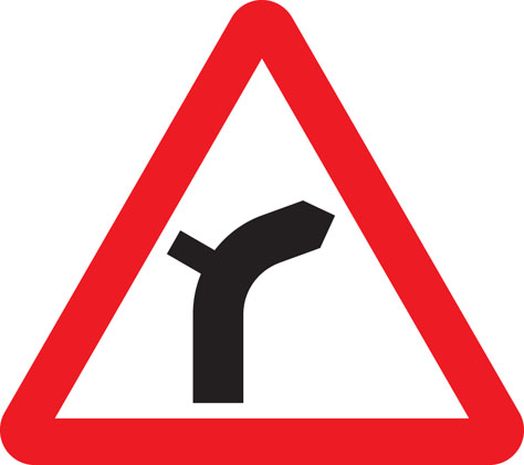 warning sign junction on bend ahead